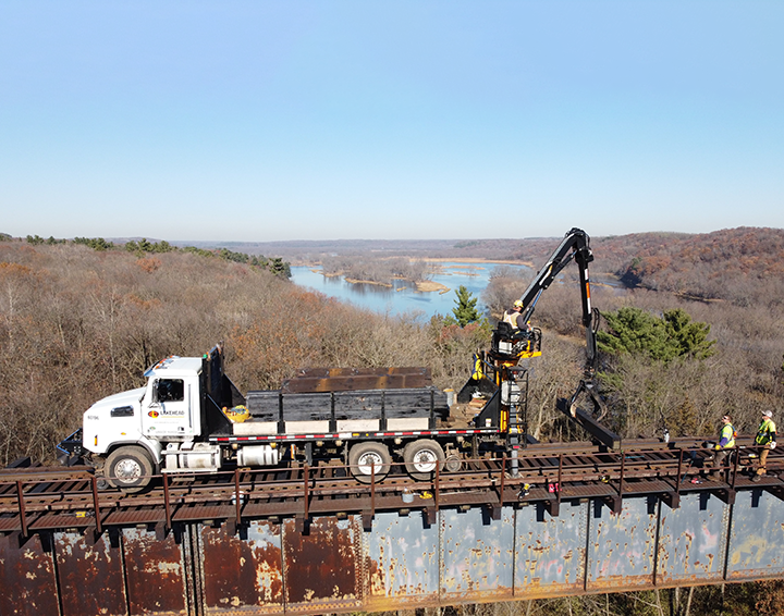 Lakehead Constructors truck on Canadian National Railway tracks for Arcola High Bridge upgrade